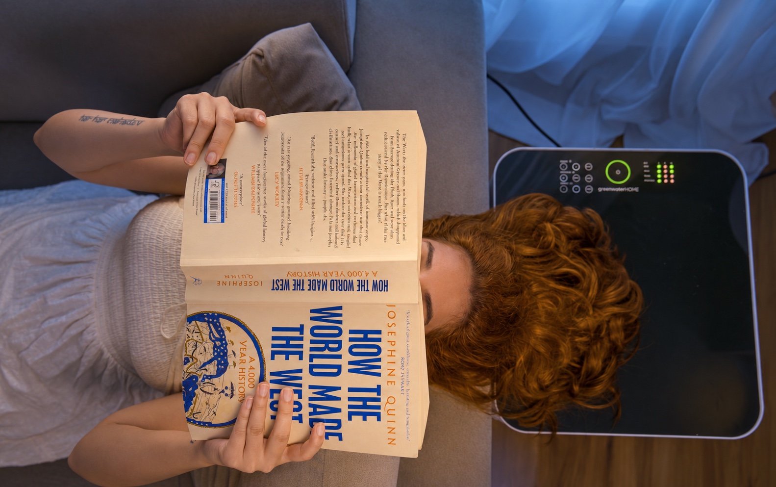 A reader winding down beside greenwaterHOME in the evening
